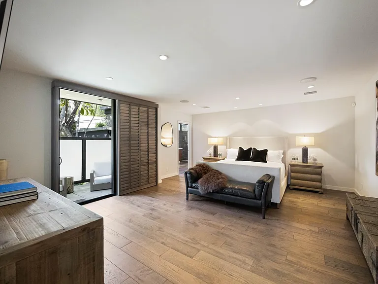 Experience unparalleled luxury in the master bedroom, featuring a spacious layout, plush furnishings.