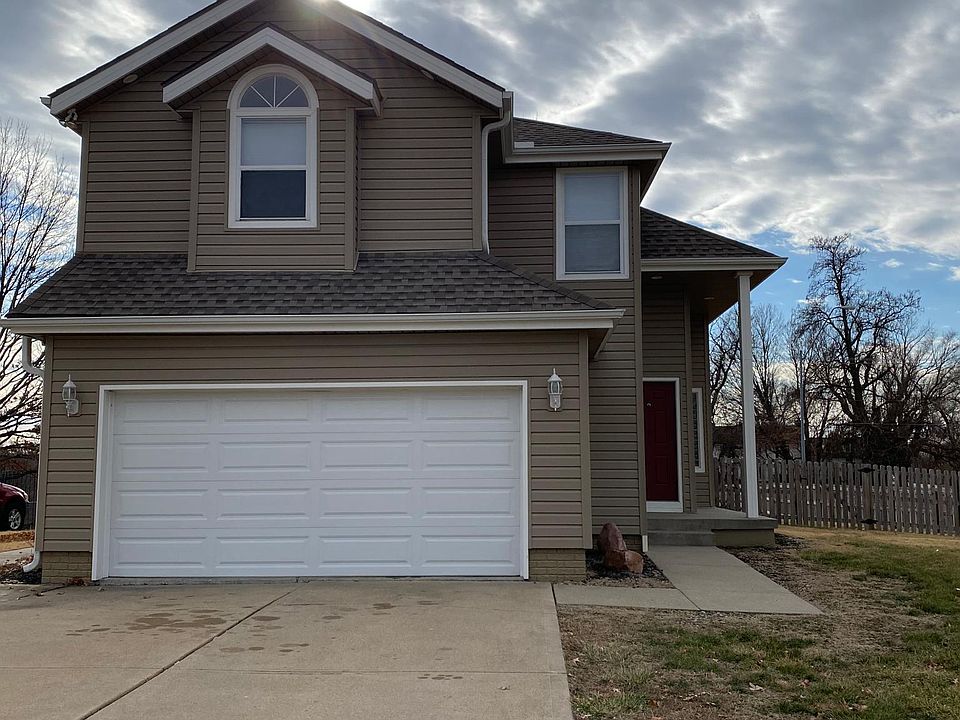 Spacious 2 car garage with storage cabinets.