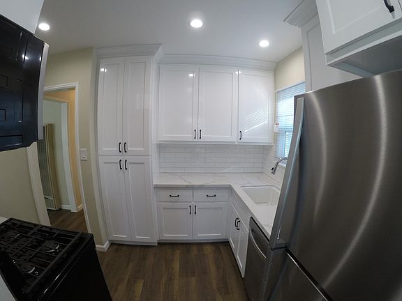 Completely remodeled kitchen, new cabinets, can lighting, quartz countertop, subway tile backsplash.
