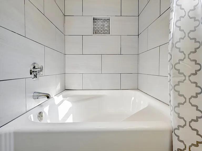 Original 4' tub with shower - re-glazed and new tile