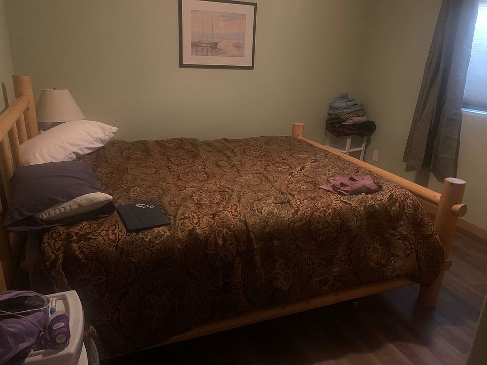 Natural light in both bedrooms with one comfortable queen bed shown here and a larger bedroom with optional twin beds available.