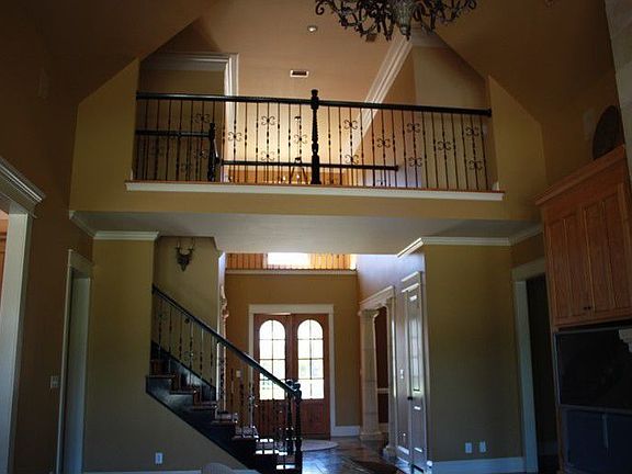 Balcony overlooking den and foyer