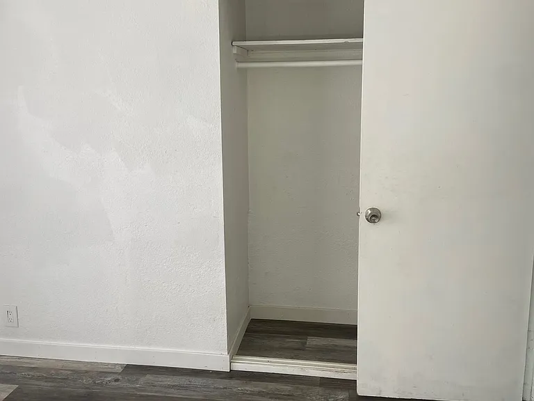 Bedroom with sliding glass door to private backyard
