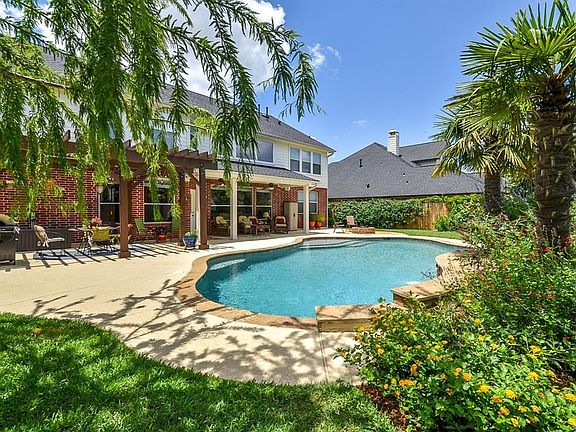 Enjoy your backyard oasis, with fire pit and salt water pool.