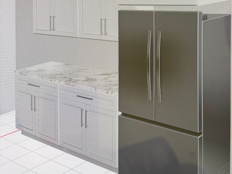 New kitchen with stainless appliances and quartz countertops under construction.