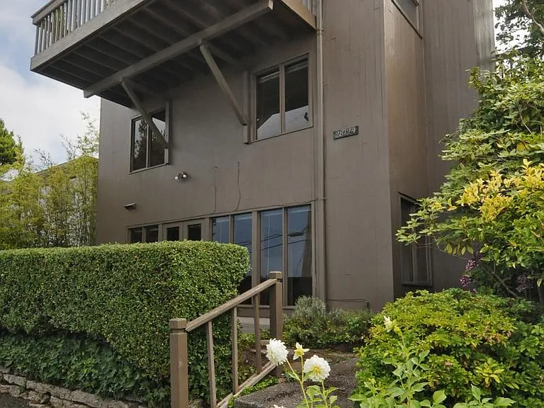 Facing east, Unit is top two floors.