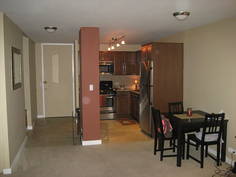 OLD Photo. Column & these walls are Now White. Right side of photo, Cherry Wood partition....Next to New Fridge w/ icemaker in bottom with slide out freezer drawer.