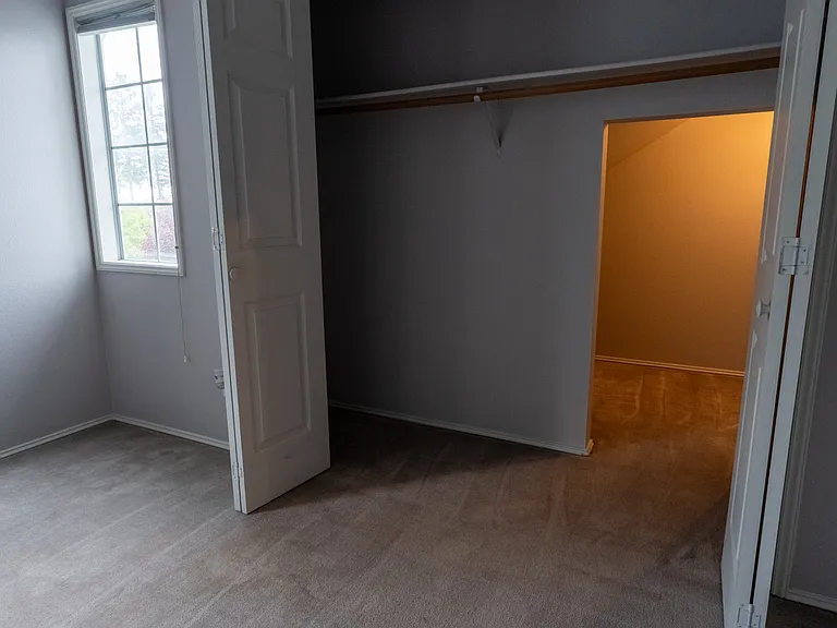 Upstairs bedroom 1 with extra storage space in closet