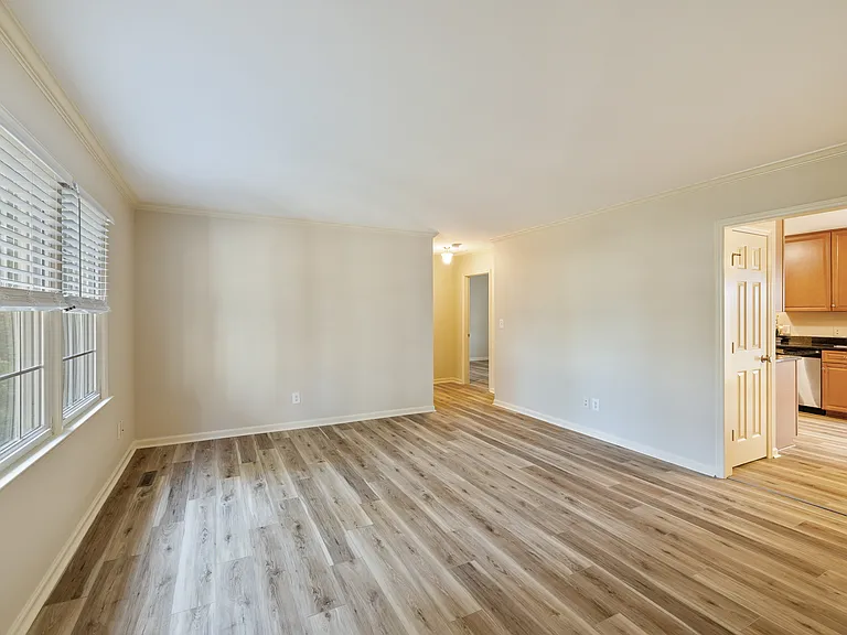 Looking from front door into living room towards back hall.