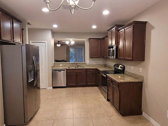 Kitchen looking into living room