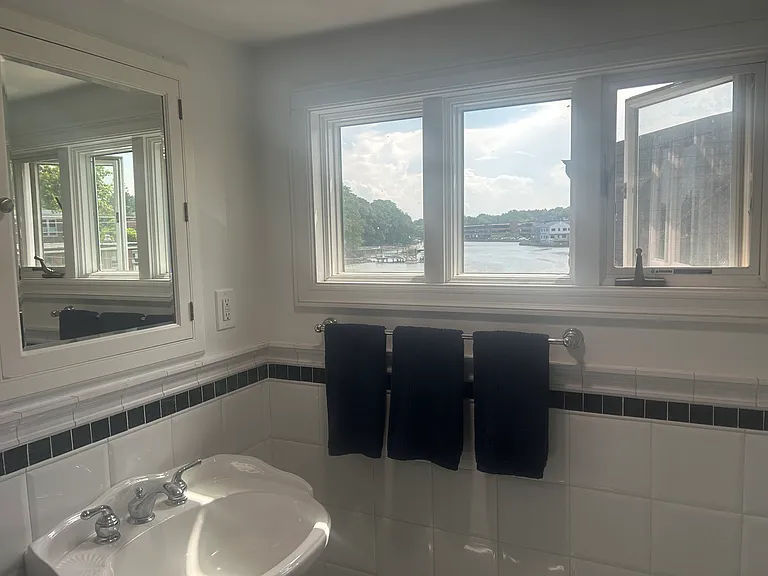 Full bath has tub/shower and water views.