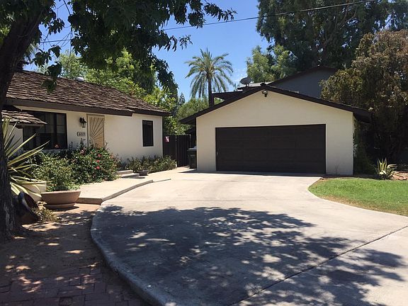 Detached 2 car garage with storage and long driveway