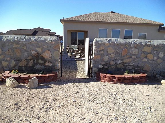 Back of house with exit gate