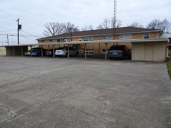 Bldg Back w/ Carport & Large Parking Lot