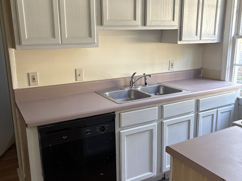 Kitchen sink, food preparation area and storage cabinets