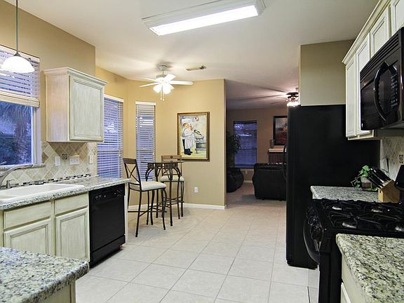 Kitchen - This kitchen and breakfast area would be any cooks dream! Granite counter-tops, designer painted wood cabinets, a great breakfast area & ample counter and cabinet space! Truly impressive!