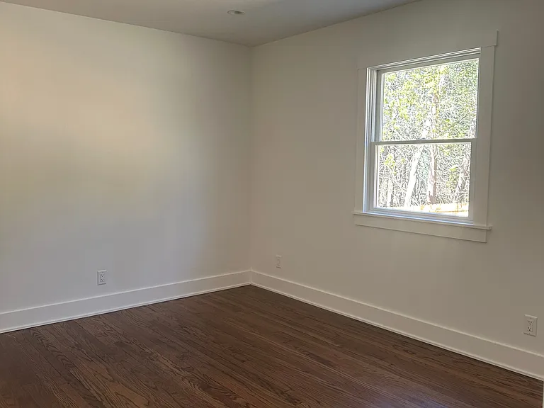 Bedroom on first floor. (Another view, overlooking back yard.)