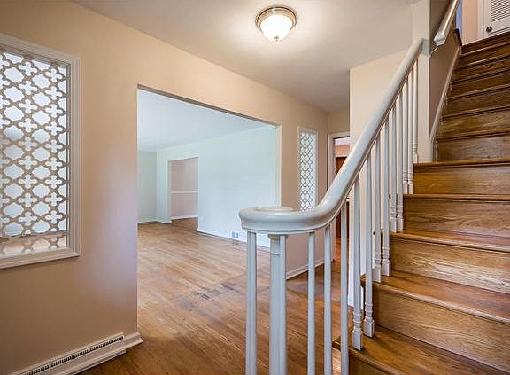 Beautiful hardwoods welcome you into the foyer
