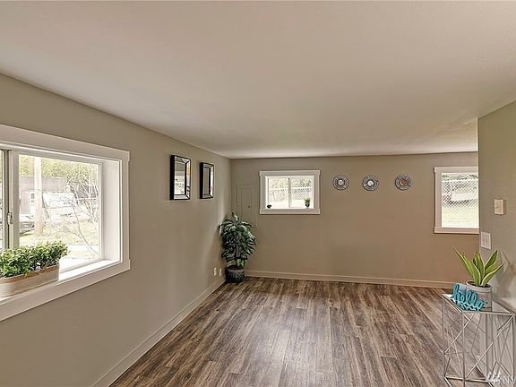 Living room looking to "bonus/office: area and entry.
