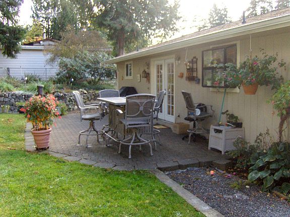 Serene patio area with French doors leading into the dining room