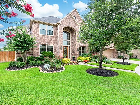 As you approach the front of this home, you will notice the lush landscaping which sets it apart from others. And yes it did win yard of the month recently!