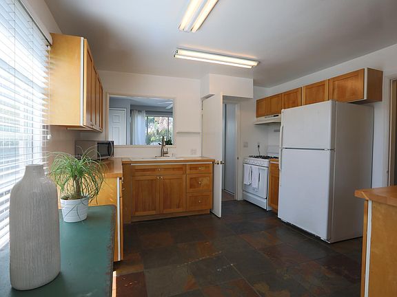 Great kitchen with butcher block counter tops and plenty of storage and space.