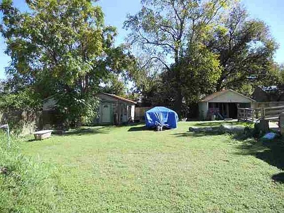 EXTRA LOT VIEW OF DETACHED GARAGE AND STORAGE BUILDING