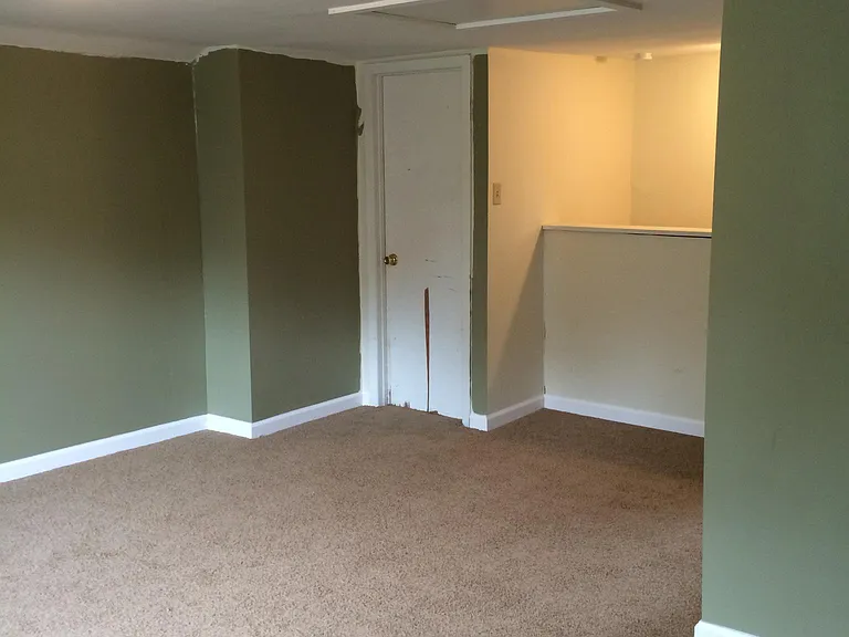 upstairs master bedroom looking at 1/2 bathroom door