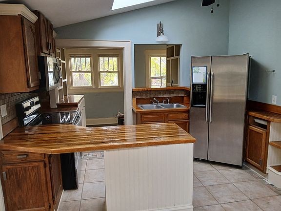 Kitchen and pantry beyond