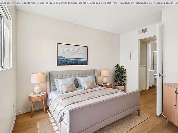 Spacious bedroom with a bright, comfortable layout.