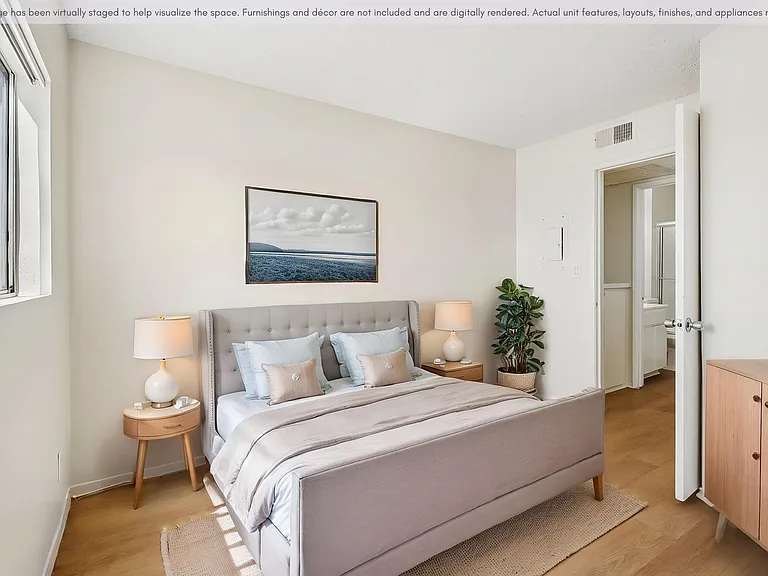 Spacious bedroom with a bright, comfortable layout.