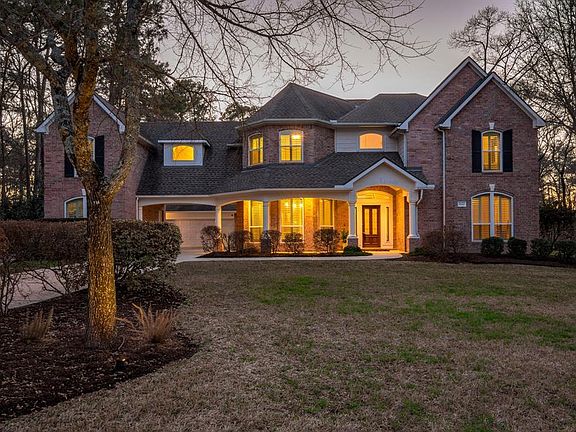 This home is nestled into a tree lined lot that provides plenty of privacy.