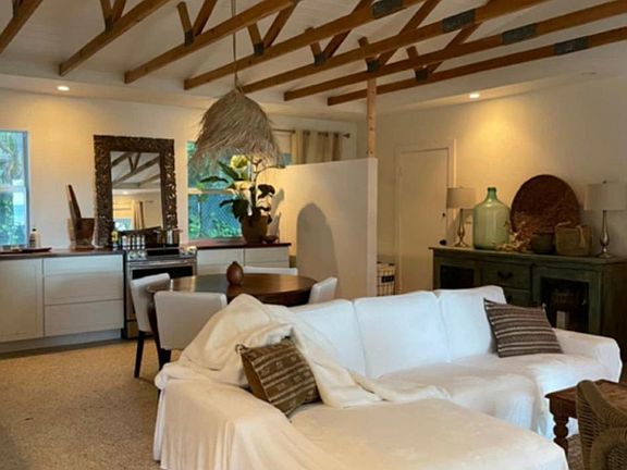 Living room with vaulted ceilings and exposed beams.