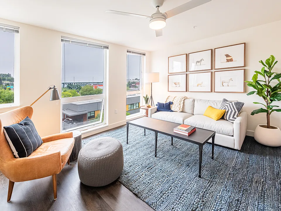 Living Room with Floor to Ceiling Windows, Ceiling Fan, and Spacious Layout