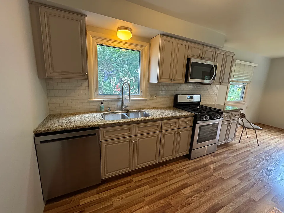 Updated kitchen with stainless steel appliances.