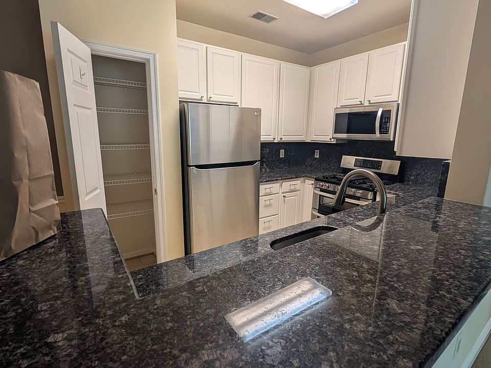 Kitchen with granite counters and upgraded appliances