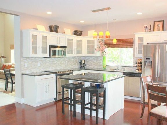 The kitchen you've been waiting for with granite counter- tops, glass tile back splash, new stainles
