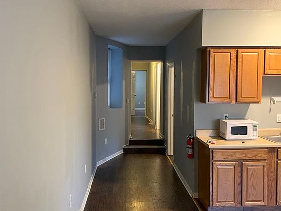 Hallway to bedrooms and kitchen