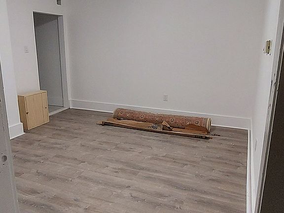 Newly painted living room with fresh floor and wall finishes