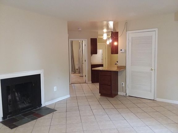 Living Room with Kitchen and Bedroom Entry View (Empty)