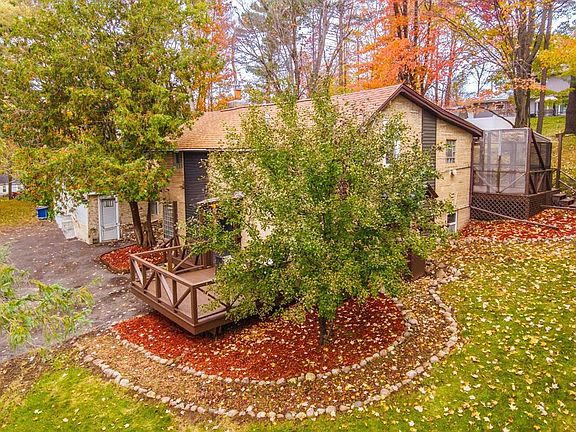 Top view of property with gardens and deck.