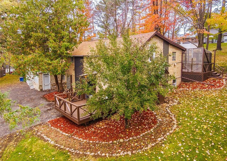 Top view of property with gardens and deck.