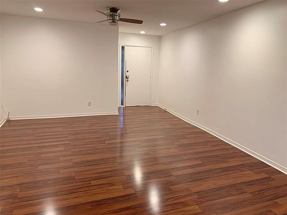 Gleaming laminate wood floors (no carpet). Recessed lights & ceiling fans in Living room and bedrooms.
