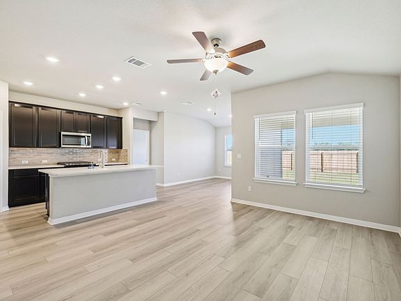 Have clear views of the dining and family rooms from the kitchen.