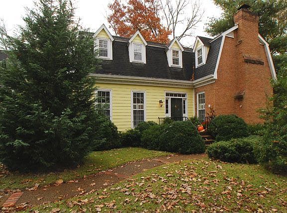 Charming cape at end of wooded cul-de-sac.