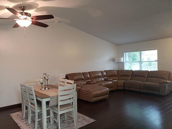 Living Room, laminate floors. Shown as furnished, will rent as unfurnished.