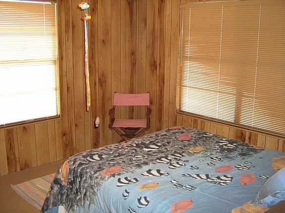 LARGE PICTURE WINDOWS LINE THE WATERSIDE OF THE HOME