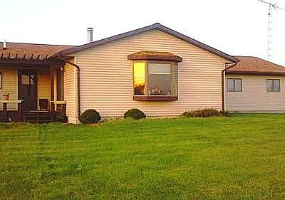 Back of house with deck