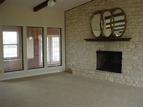 Formal living room with fireplace.