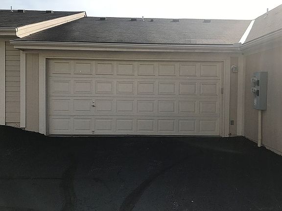 Two car garage with parking 